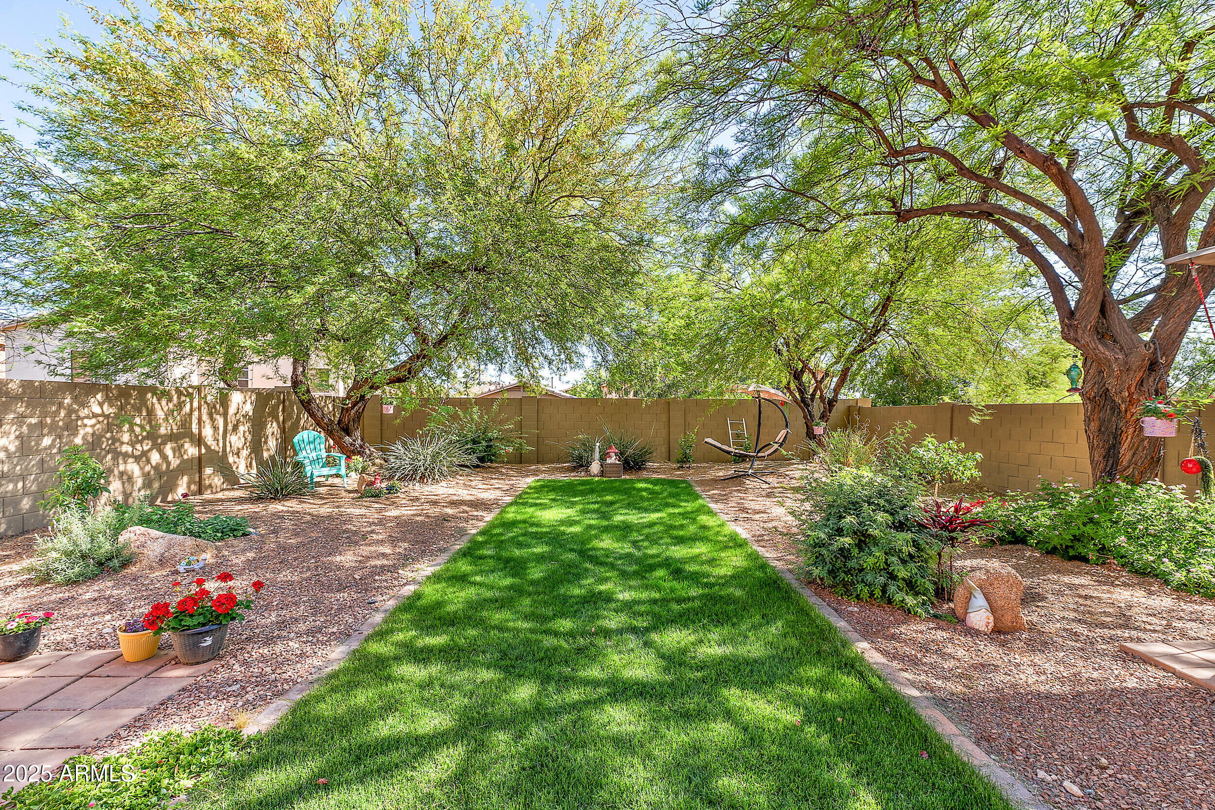 3643 West Medinah Court Anthem, AZ 85086 - Photo 45 of 58 a view of a garden with a tree