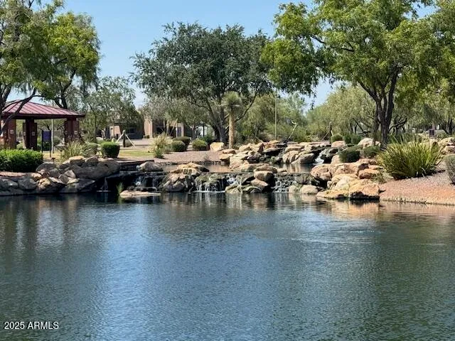 a view of a lake with a house in the background
