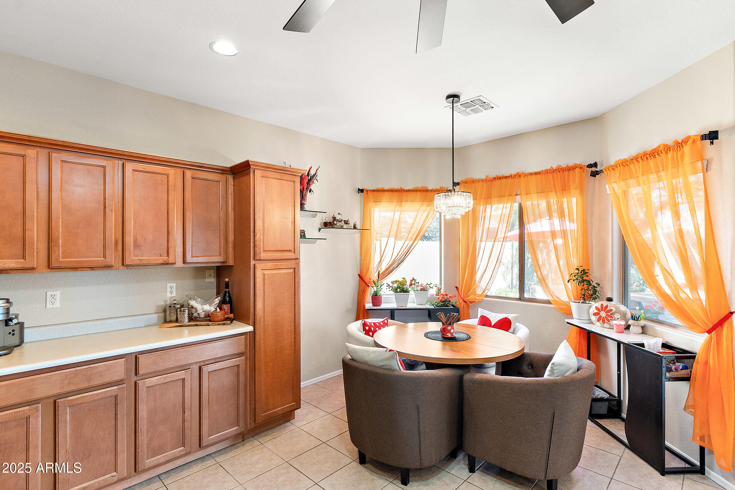 3643 West Medinah Court Anthem, AZ 85086 - Photo 6 of 58 a room with granite countertop a sink and a refrigerator