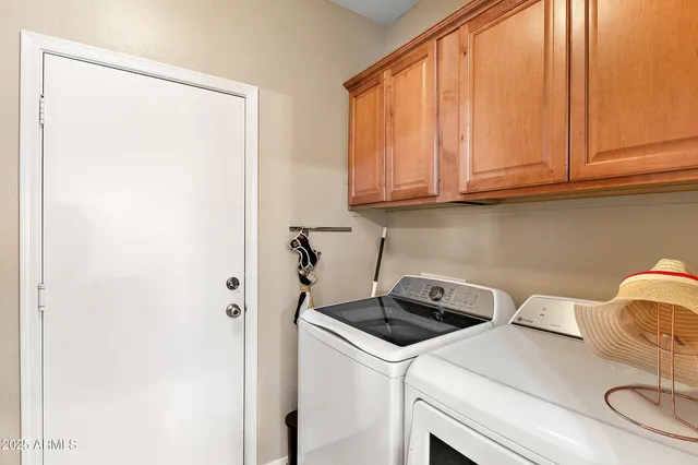 a bedroom with furniture and a flat screen tv
