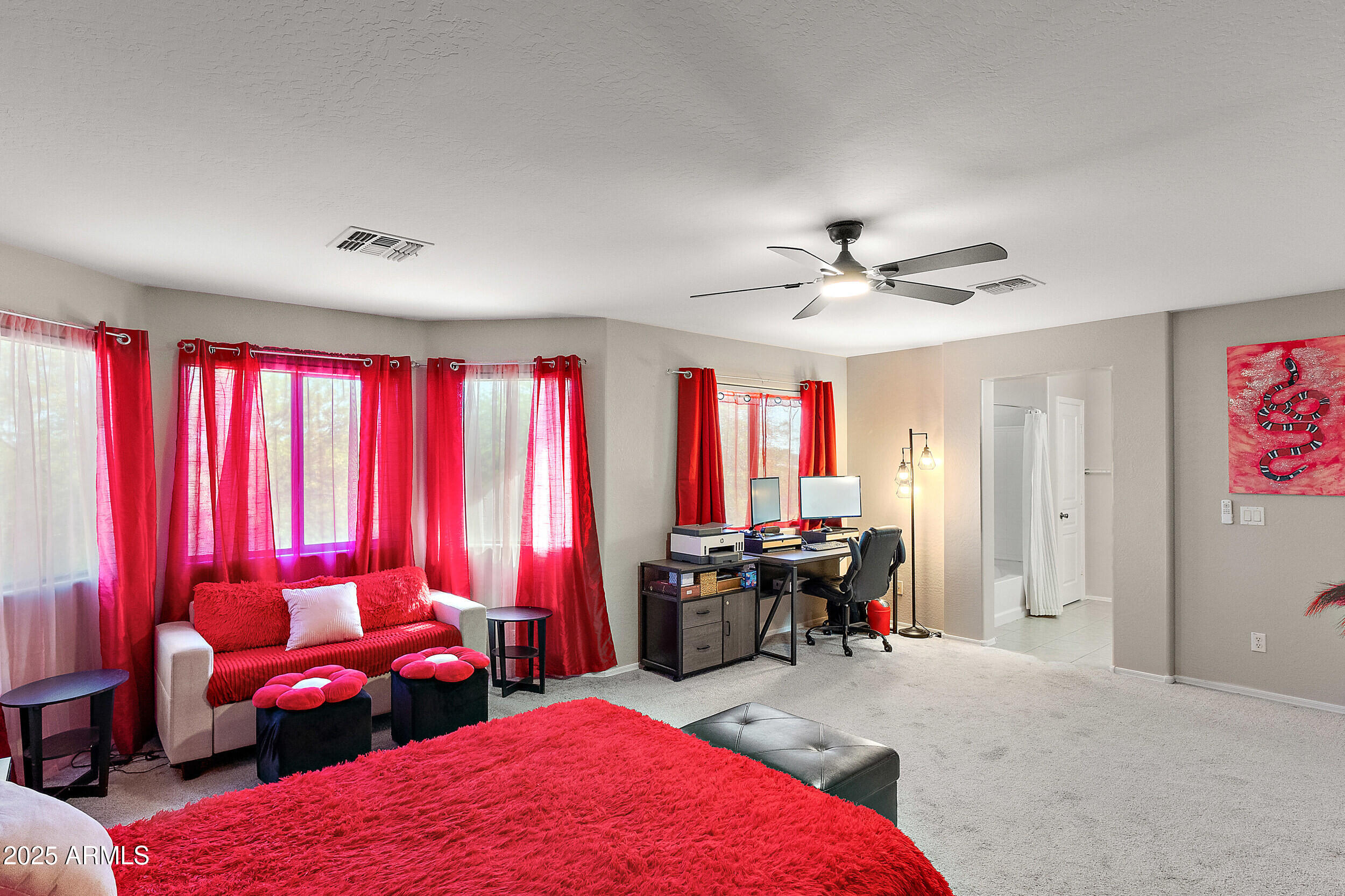3643 West Medinah Court Anthem, AZ 85086 - Photo 10 of 58 a living room with furniture a large window and a chandelier