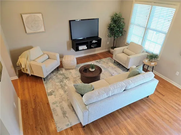 a living room with furniture and a flat screen tv