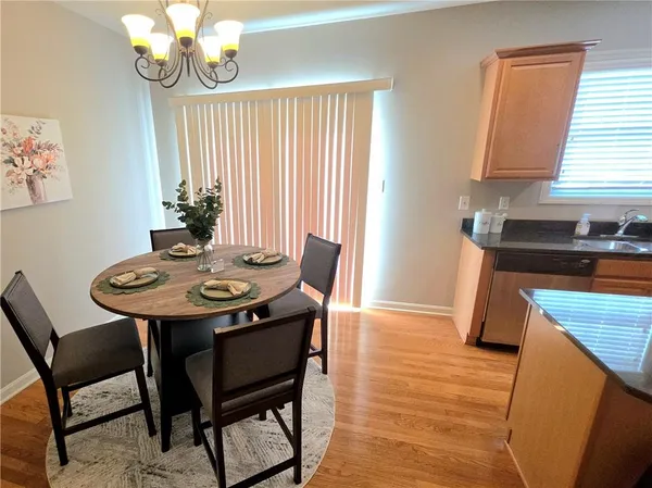 a view of a dining room with furniture and window