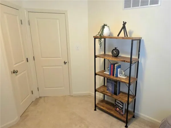 a view of a workspace with bookshelf