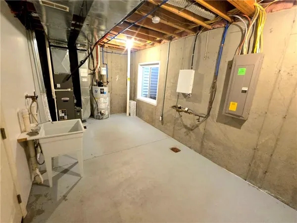 a view of a room with wooden floor and windows