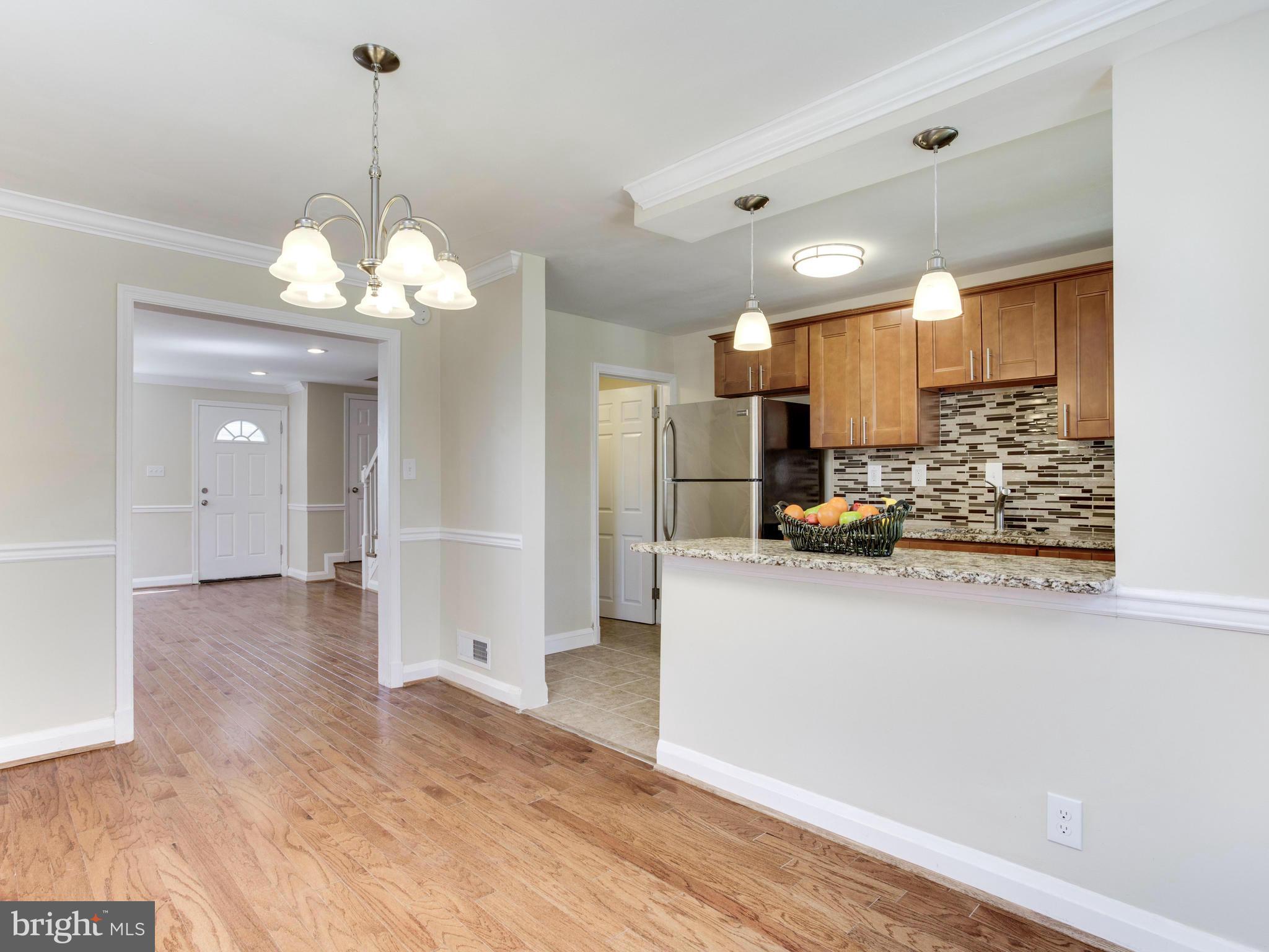 4400 Eldone Road Baltimore, MD 21229 - Photo 11 of 30 a view of a kitchen with refrigerator and wooden floor