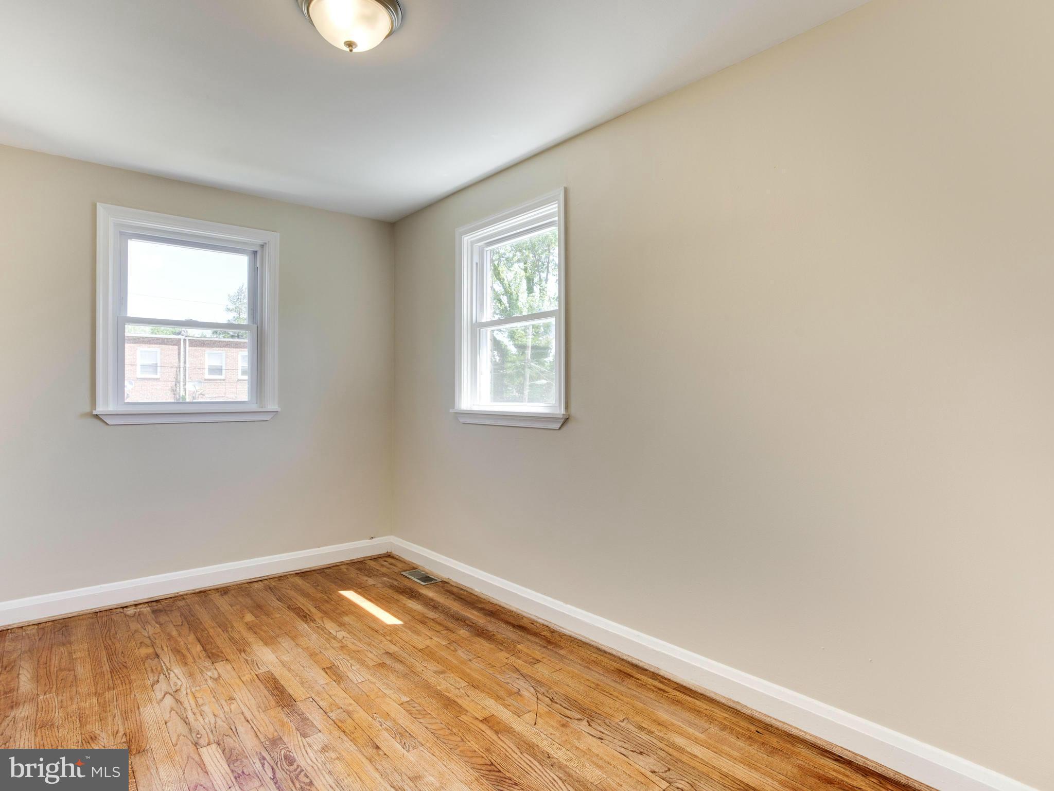 4400 Eldone Road Baltimore, MD 21229 - Photo 16 of 30 a view of empty room with wooden floor and fan