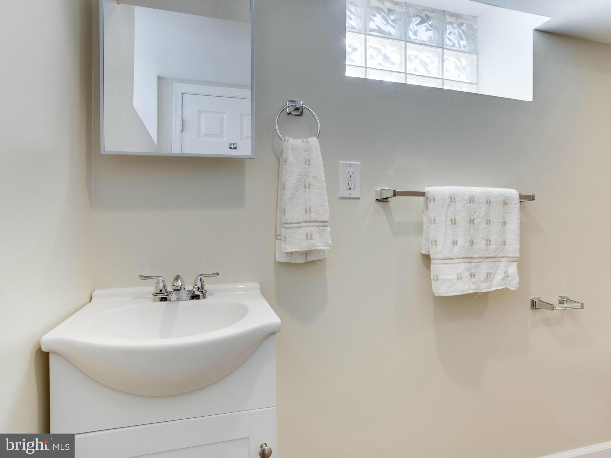 4400 Eldone Road Baltimore, MD 21229 - Photo 25 of 30 a bathroom with a sink and a mirror