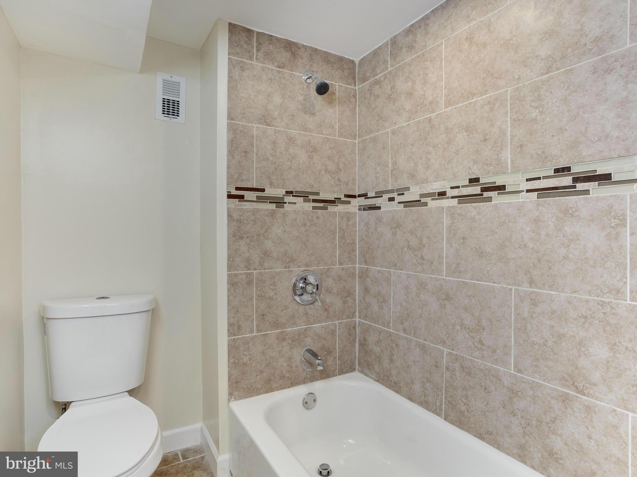 4400 Eldone Road Baltimore, MD 21229 - Photo 26 of 30 a bathroom with a toilet and shower