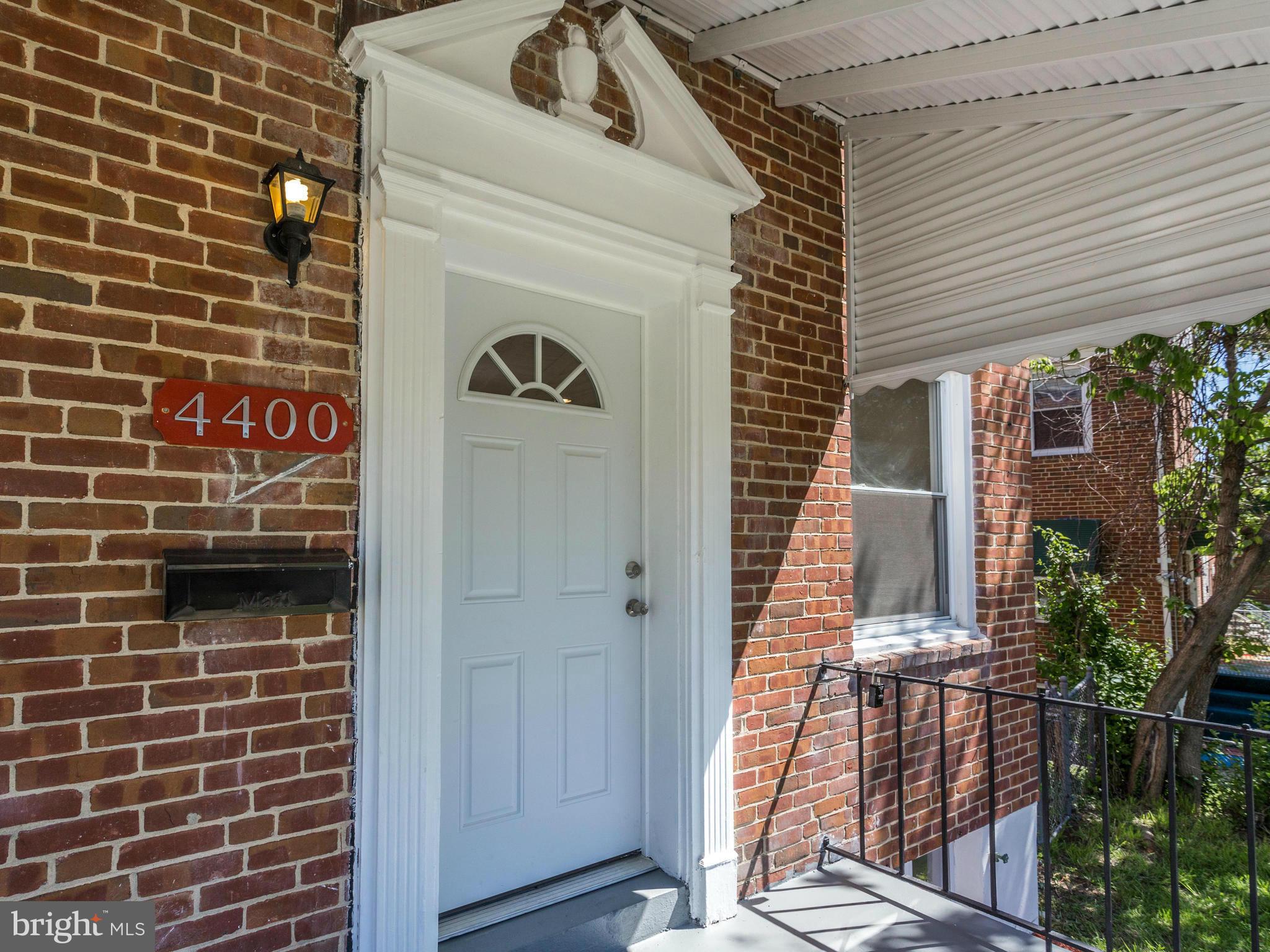 4400 Eldone Road Baltimore, MD 21229 - Photo 4 of 30 a view of a door and brick wall