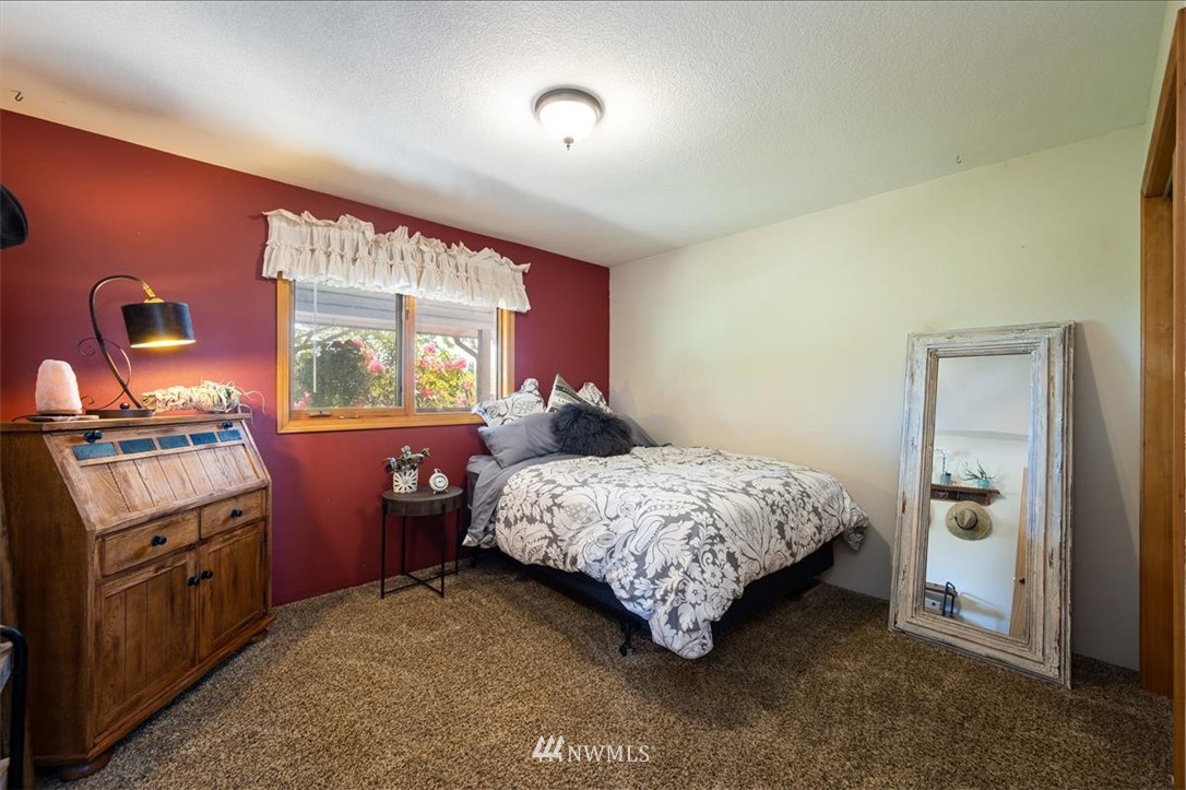 320 East Axton Road Bellingham, WA 98226 - Photo 18 of 40 a bed room with a bed and a tv