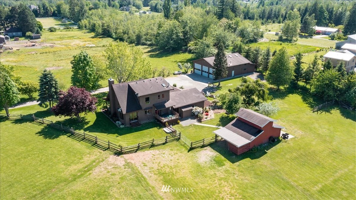 320 East Axton Road Bellingham, WA 98226 - Photo 23 of 40 a view of a swimming pool with lawn chairs and a yard