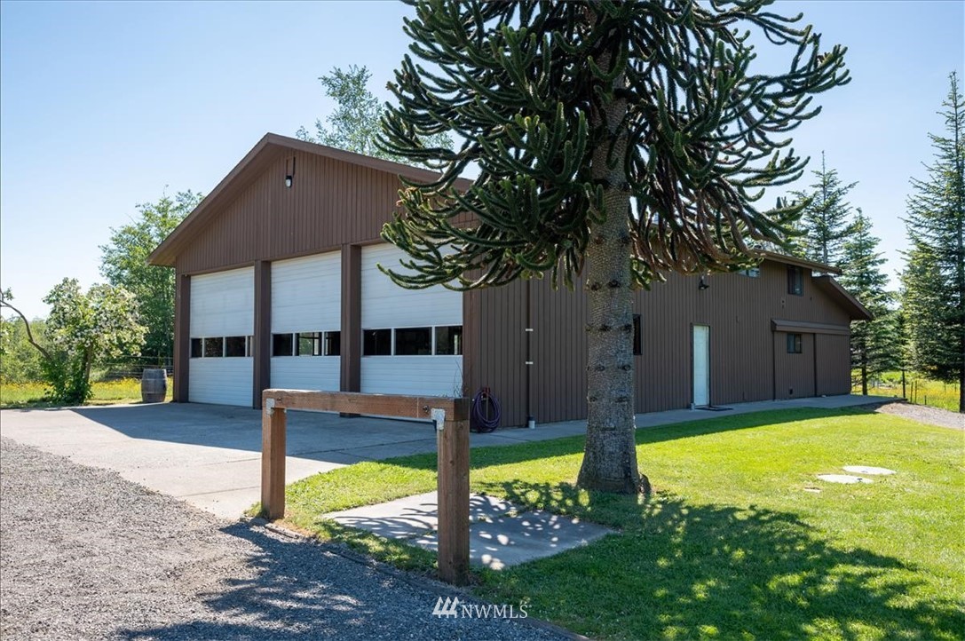 320 East Axton Road Bellingham, WA 98226 - Photo 24 of 40 a view of a house with backyard and a tree
