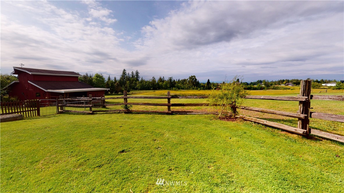320 East Axton Road Bellingham, WA 98226 - Photo 35 of 40 a view of a swimming pool with a bench and trees in the background