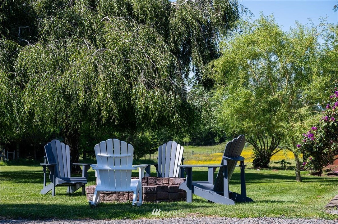 320 East Axton Road Bellingham, WA 98226 - Photo 36 of 40 a view of a park with plants and bench