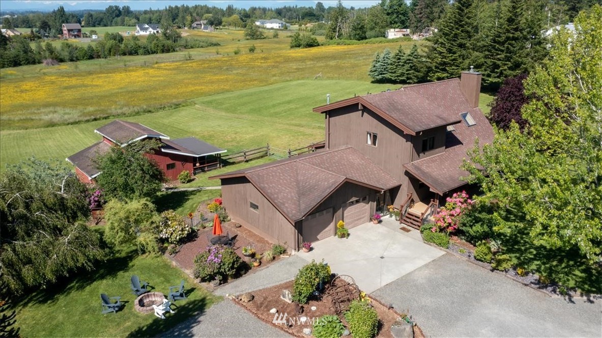 320 East Axton Road Bellingham, WA 98226 - Photo 39 of 40 an aerial view of a house with a garden and lake view