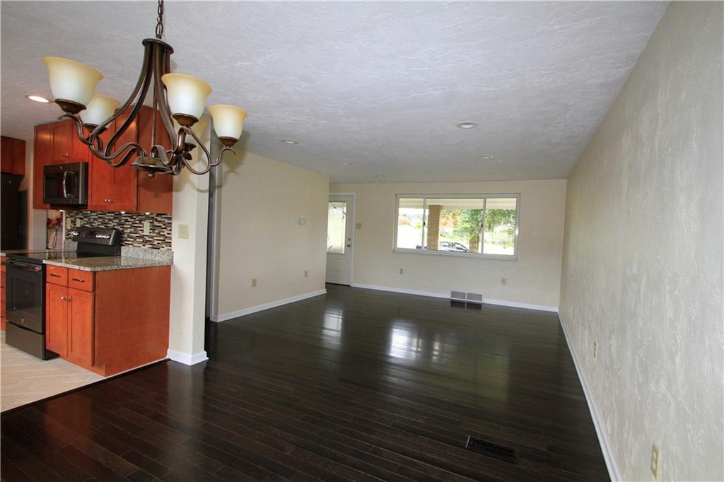 101 Louis Street McKees Rocks, PA 15136 - Photo 5 of 24 dining room/living room/ kitchen