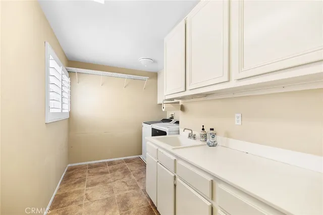 a bathroom with a sink and a cabinets