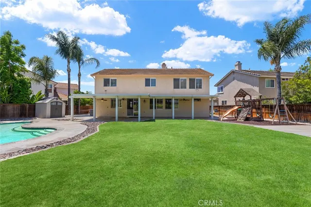 a front view of a house with a garden and porch