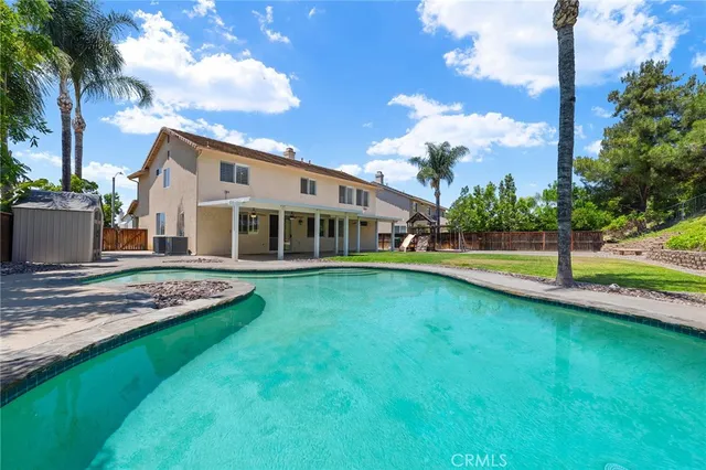 a view of a house with a swimming pool