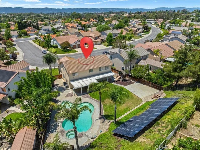 an aerial view of a house with a garden