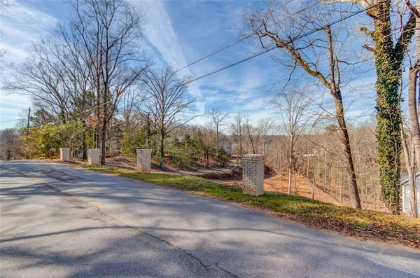a view of a street with houses on both side