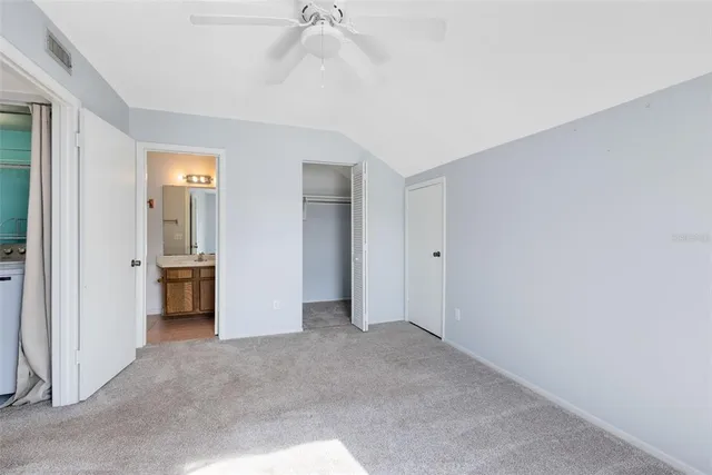 a bathroom with a sink a toilet and shower curtain