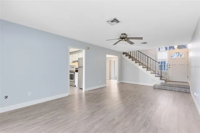 a view of an entryway with wooden floor