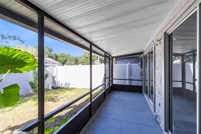 a front view of a house with a yard and a garage