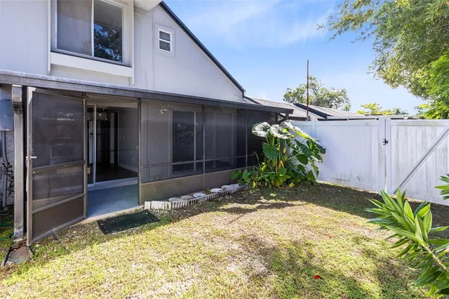 an aerial view of a house with a swimming pool