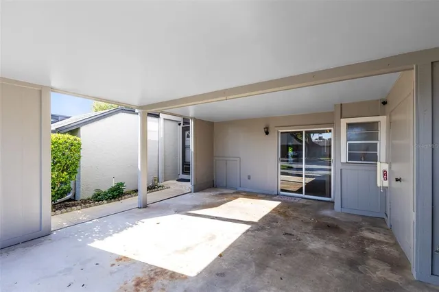 an aerial view of a house with a yard and lake view