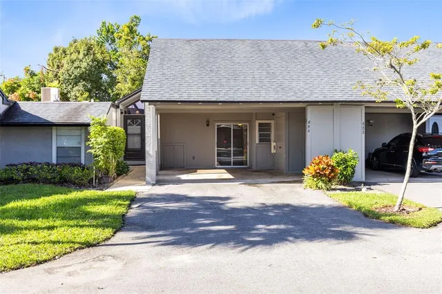 an aerial view of residential houses with city view