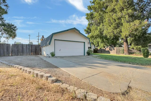 a view of garage yard and tree