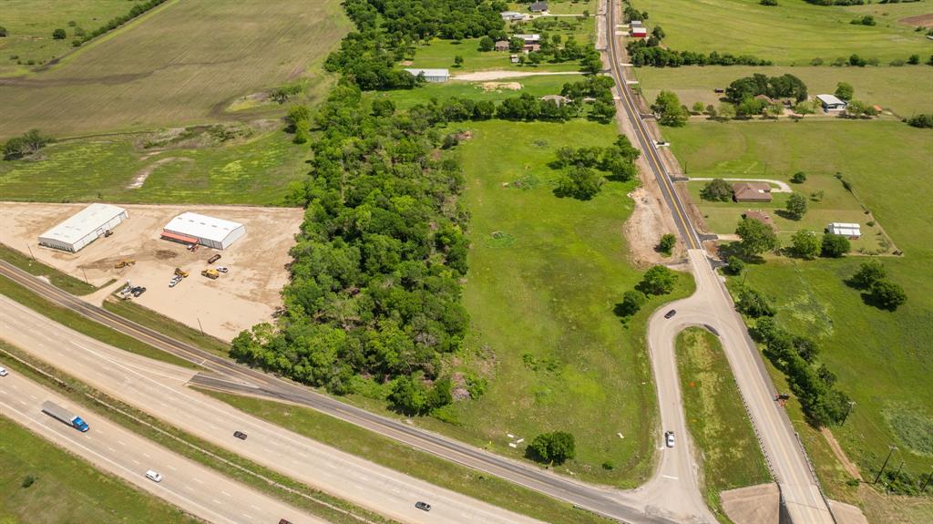45 North Interstate 45 Ennis, TX 75119 - Photo 2 of 12 Expansive commercial land featuring two substantial warehouse structures
