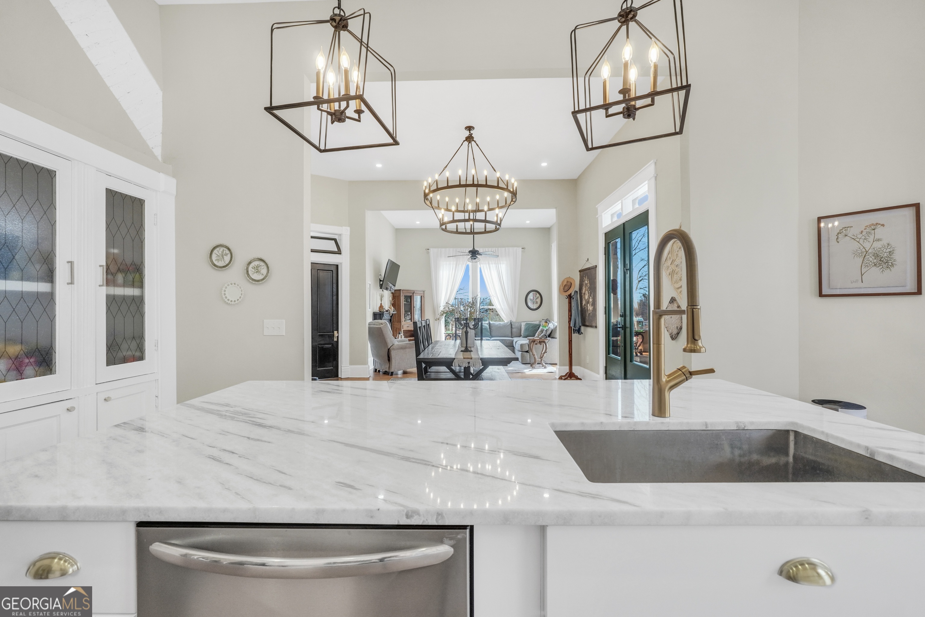 263 Julia Street Monticello, GA 31064 - Photo 16 of 49 a view of a kitchen with a sink and chandelier