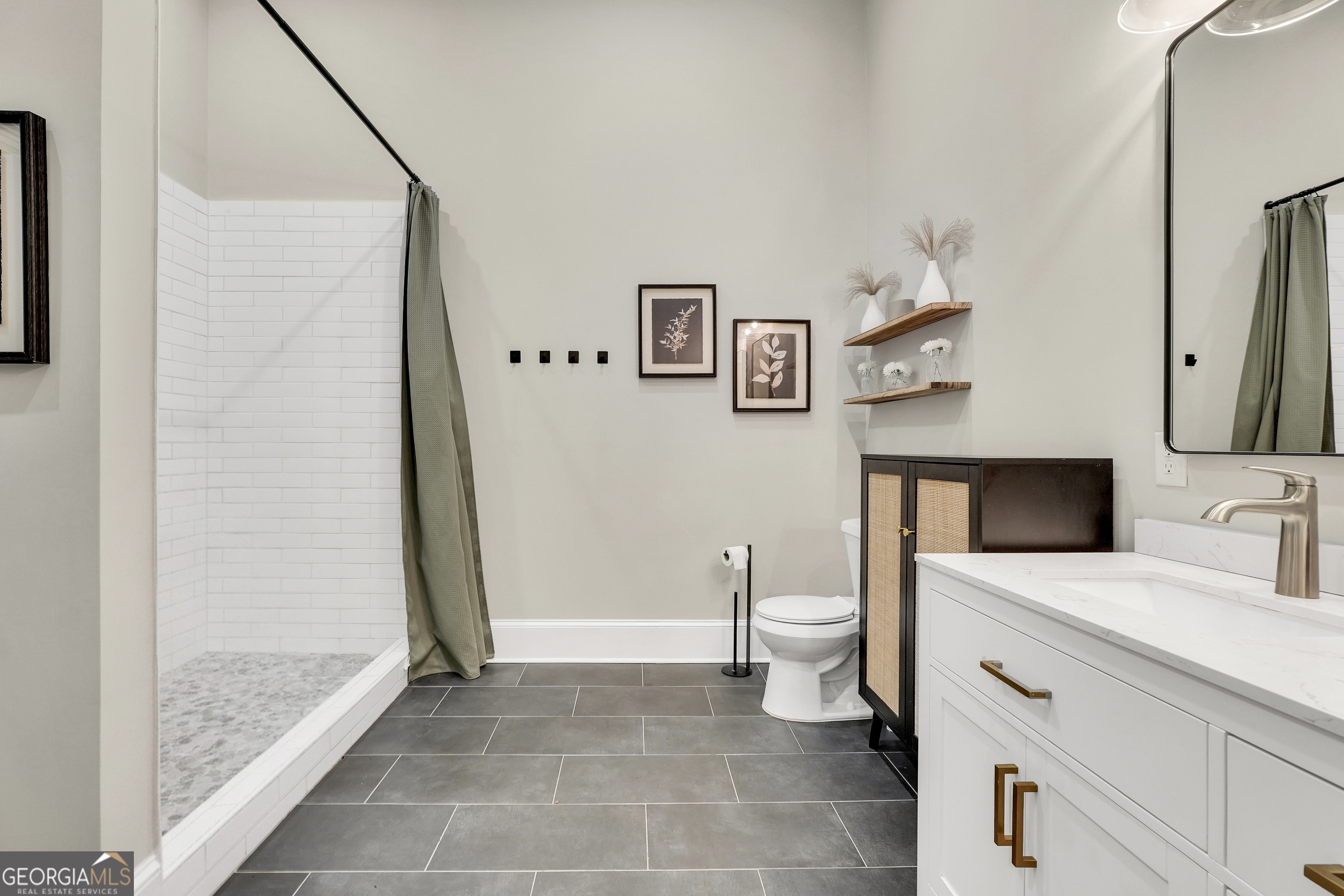 263 Julia Street Monticello, GA 31064 - Photo 29 of 49 a bathroom with a sink a toilet and shower