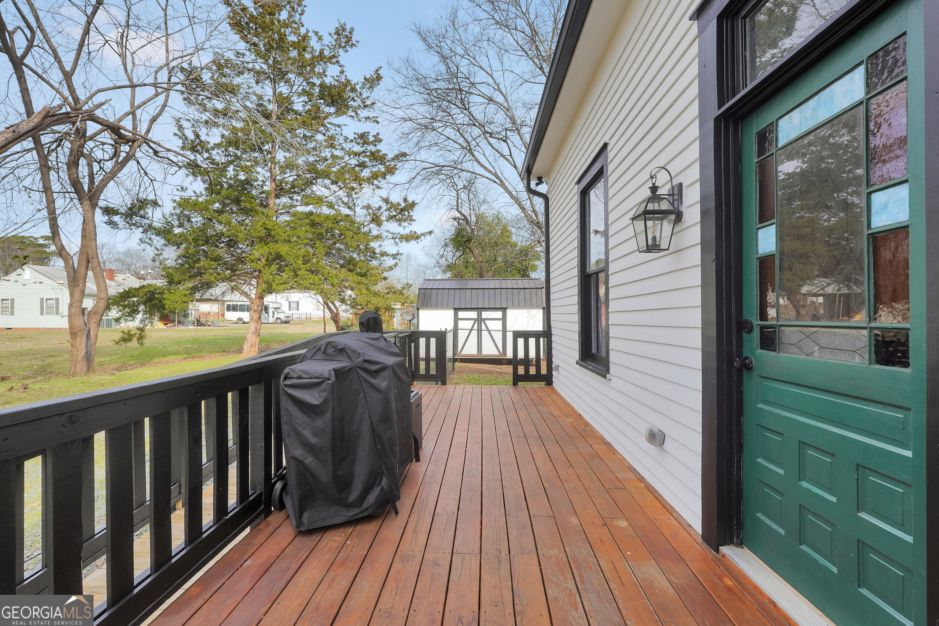 263 Julia Street Monticello, GA 31064 - Photo 46 of 49 a view of balcony with wooden floor and fence