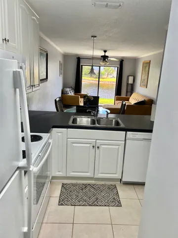 a view of a floor to ceiling window and a yard