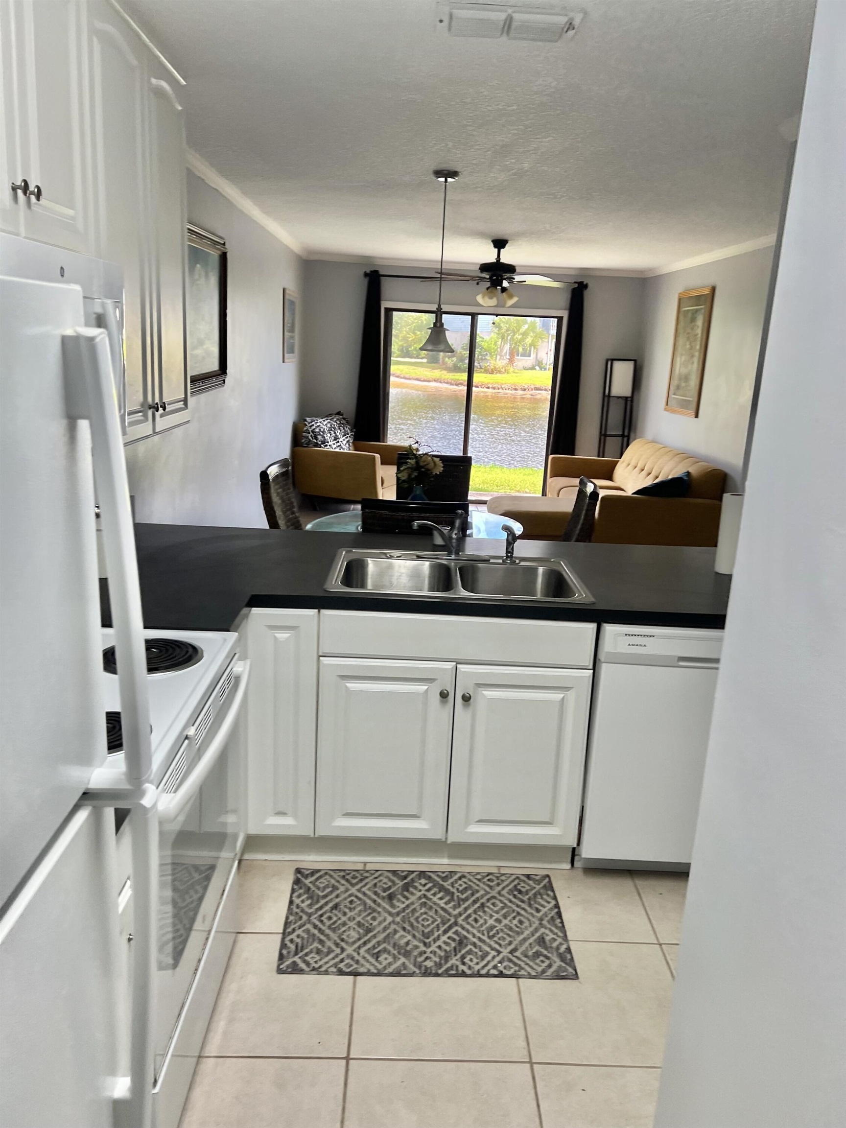 700 West Pope Road, Unit E39 St. Augustine, FL 32080 - Photo 14 of 16 a bathroom with a sink a mirror and a bathtub