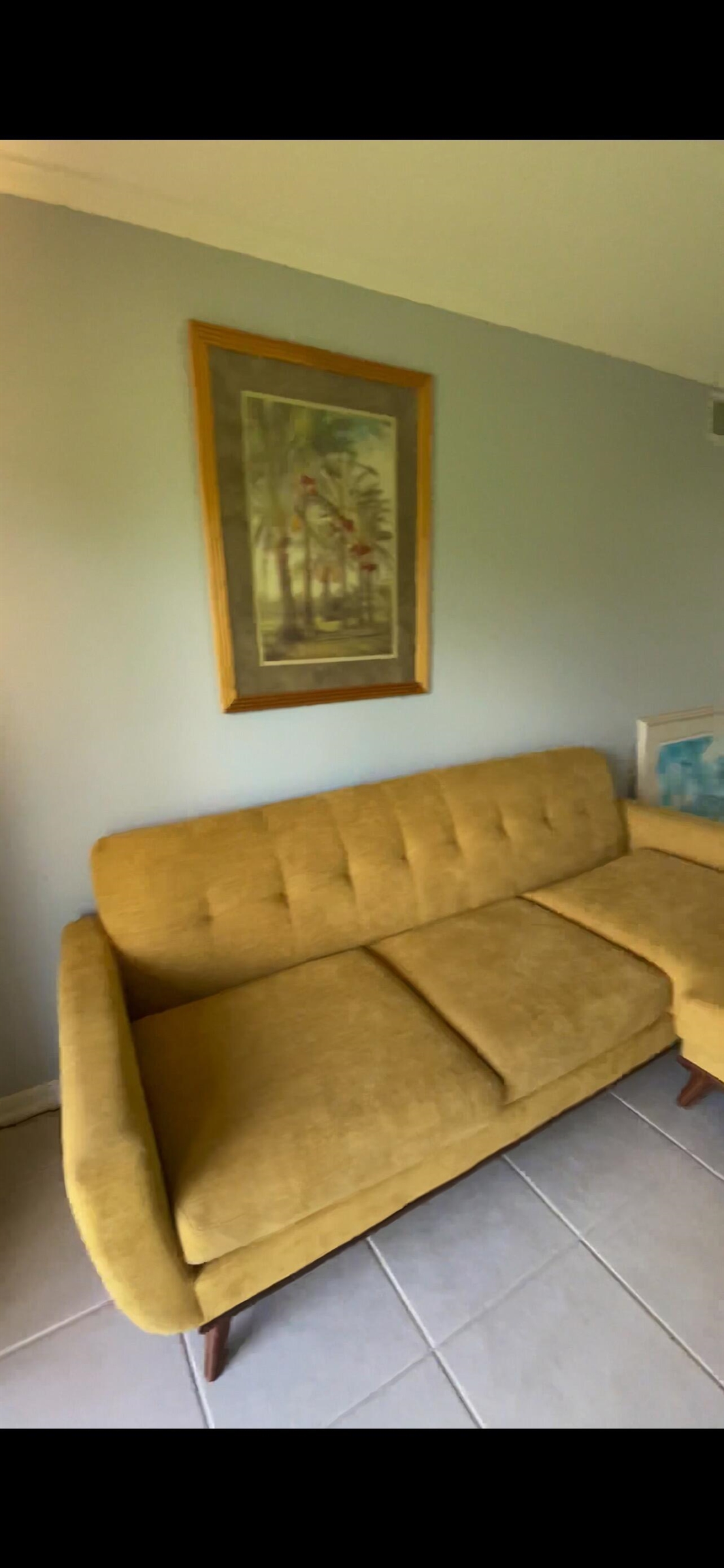 700 West Pope Road, Unit E39 St. Augustine, FL 32080 - Photo 6 of 16 a view of a couch in a room