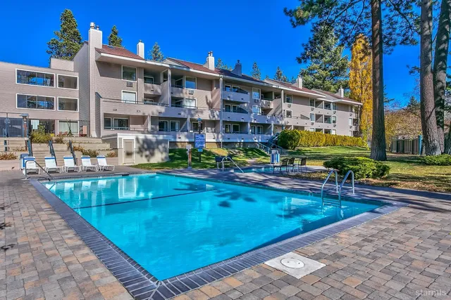 a view of building with a swimming pool