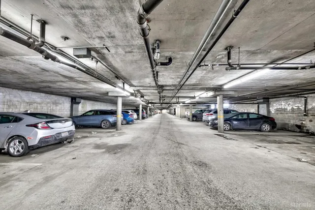 a view of parking garage with cars