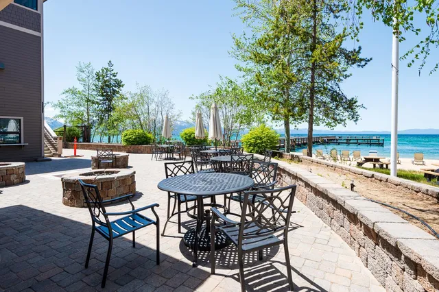a patio with water table and chairs