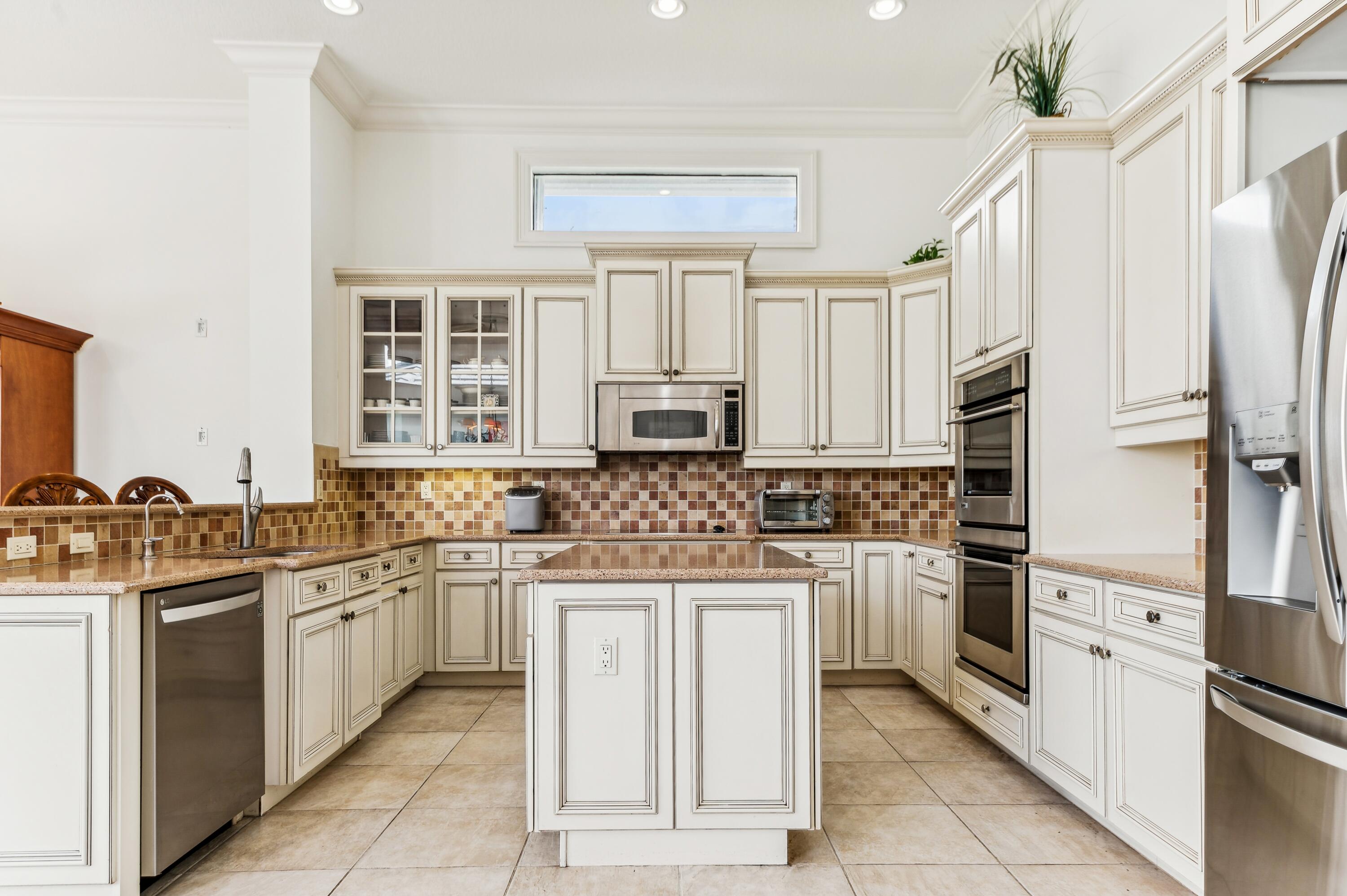 8871 Equus Circle Boynton Beach, FL 33472 - Photo 27 of 64 09_8871EquusCircle_5_Kitchen_HiRes