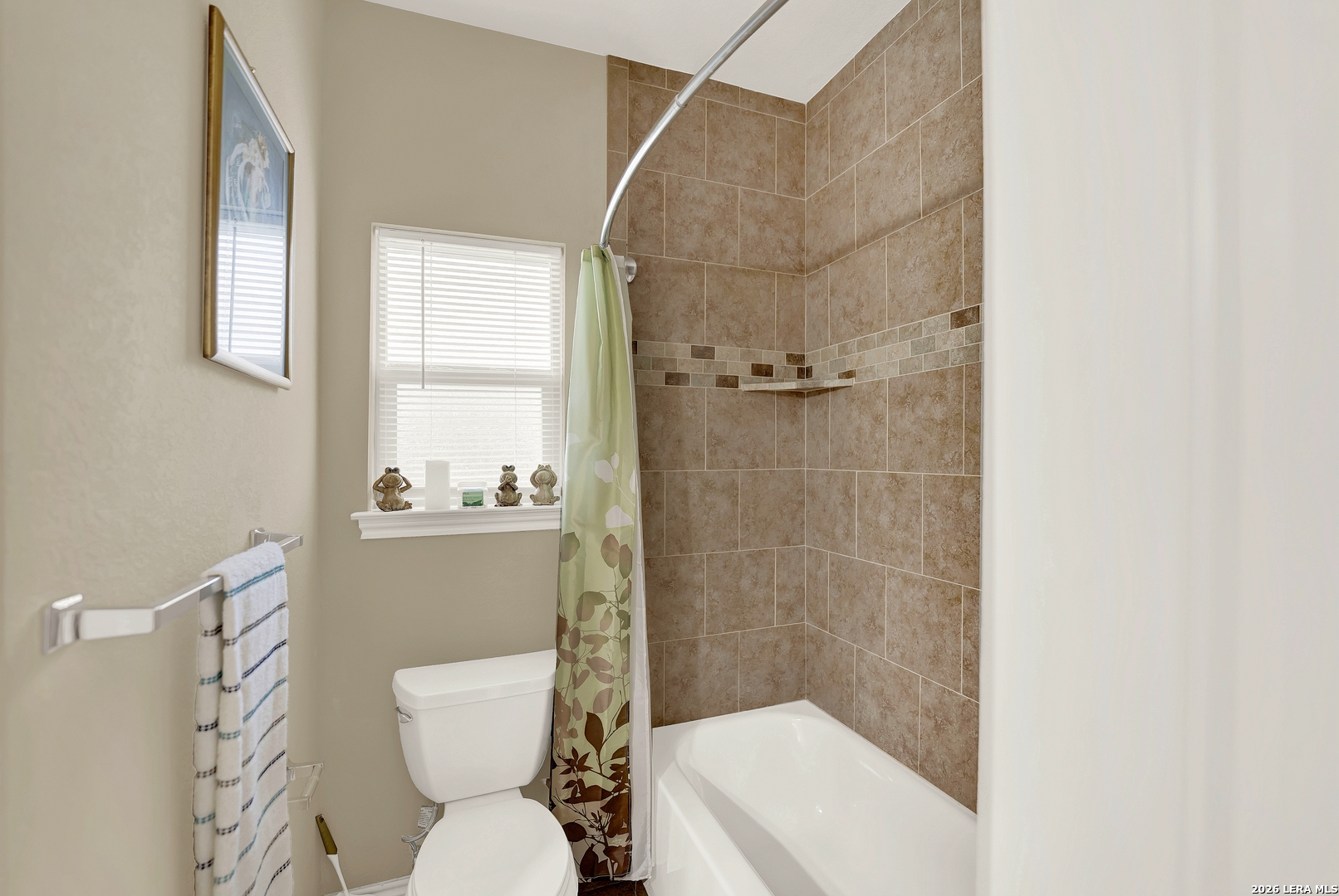11669 Flores Avenue LaCoste, TX 78039 - Photo 11 of 36 a bathroom with a toilet and a shower