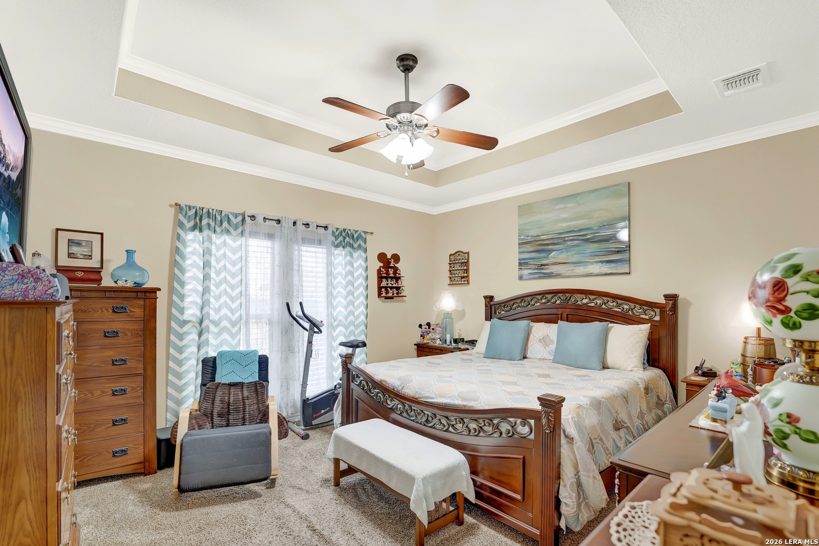 11669 Flores Avenue LaCoste, TX 78039 - Photo 13 of 36 a bedroom with a bed and a chandelier