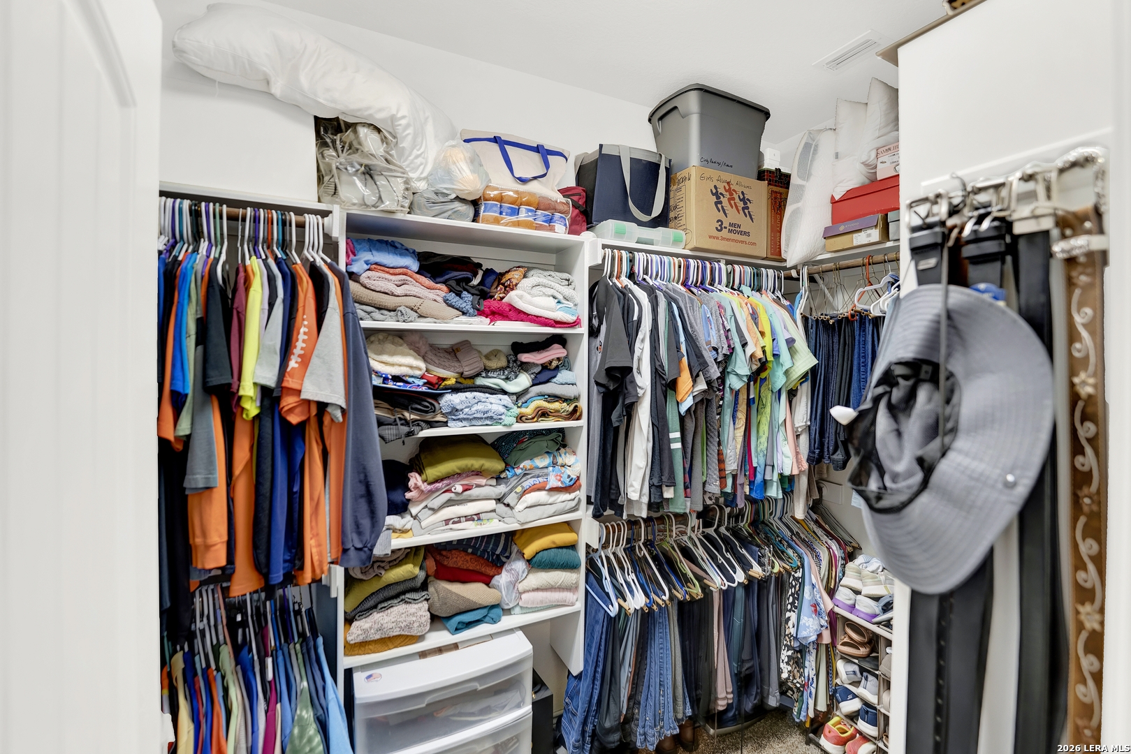 11669 Flores Avenue LaCoste, TX 78039 - Photo 15 of 36 a view of walk in closet with clothes and shoes