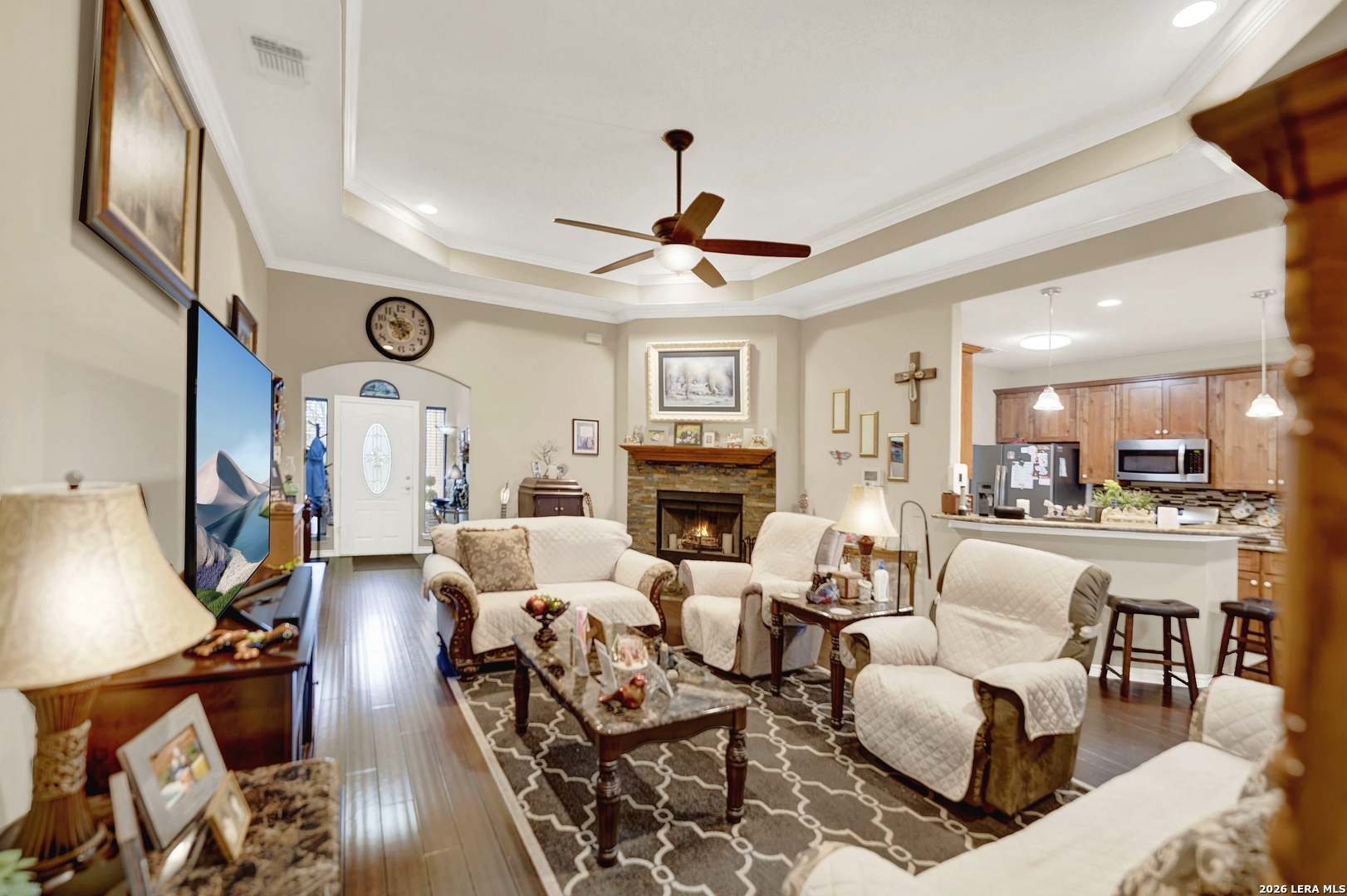 11669 Flores Avenue LaCoste, TX 78039 - Photo 19 of 36 a living room with fireplace furniture and a large window