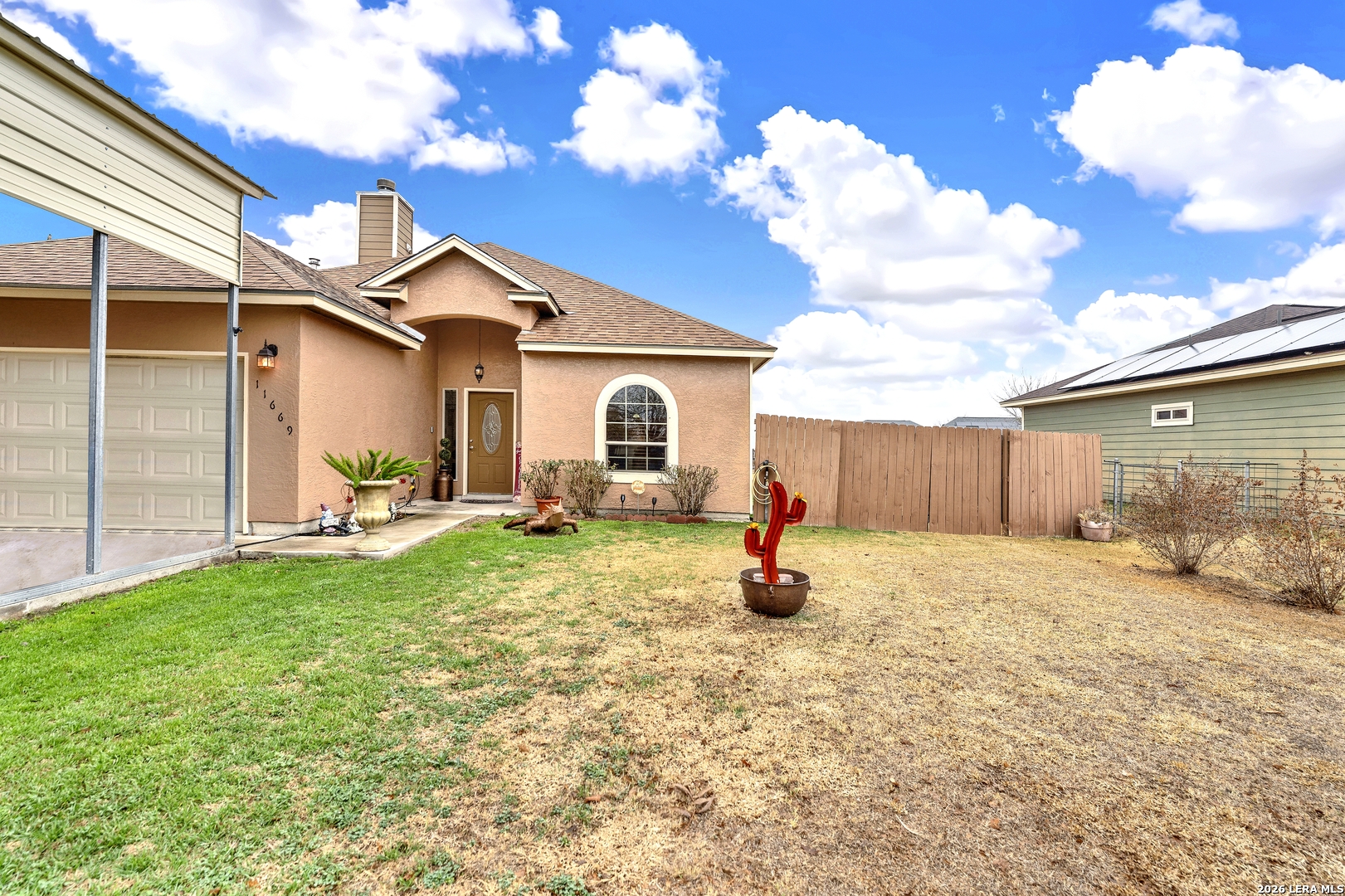 11669 Flores Avenue LaCoste, TX 78039 - Photo 2 of 36 a view of a house with backyard and sitting area