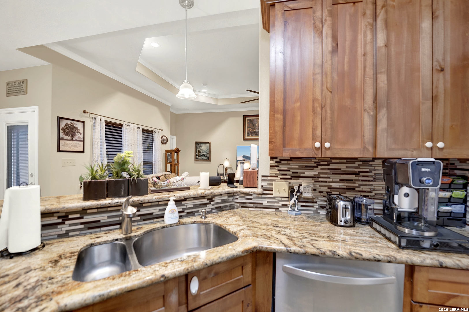 11669 Flores Avenue LaCoste, TX 78039 - Photo 25 of 36 a kitchen with a sink and a stove top oven